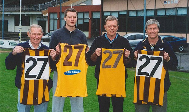 Which professional football players wore the number 27 jersey?